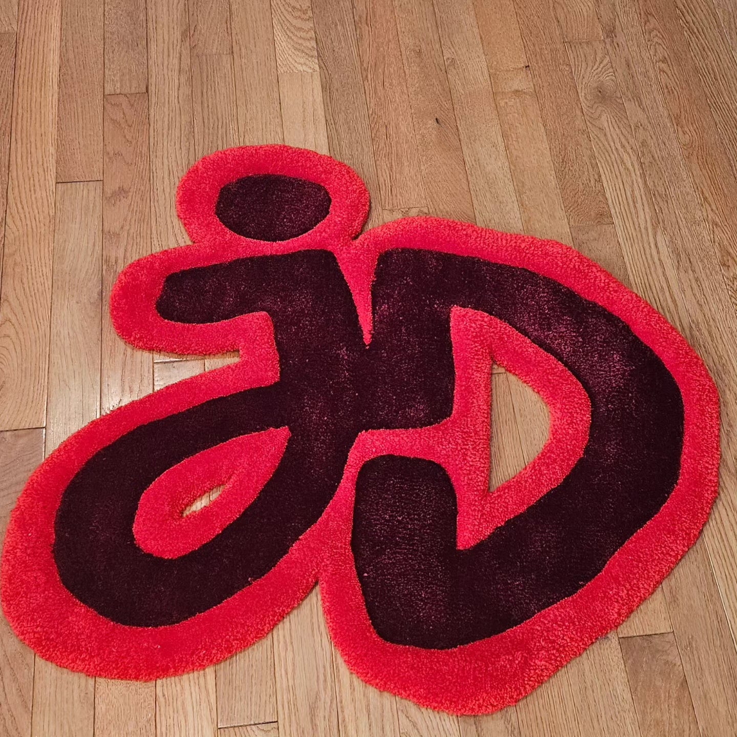 Outline styed Tufted fiber art of the Joong/Dunk ship logo with plush texture, vibrant colors, and carved sculptural detail, handmade for BL fans
