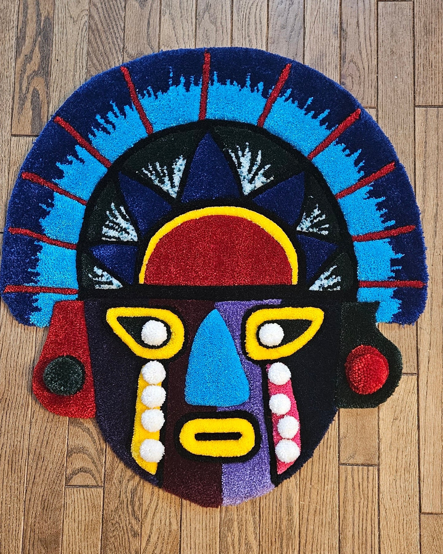 Vibrant Tribal Mask: Hand-Tufted Fiber Art Rug