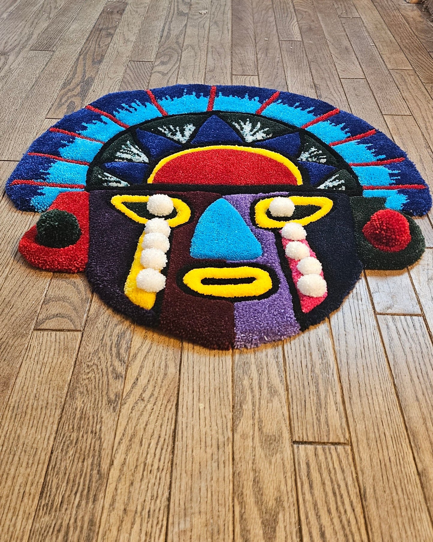 Vibrant Tribal Mask: Hand-Tufted Fiber Art Rug