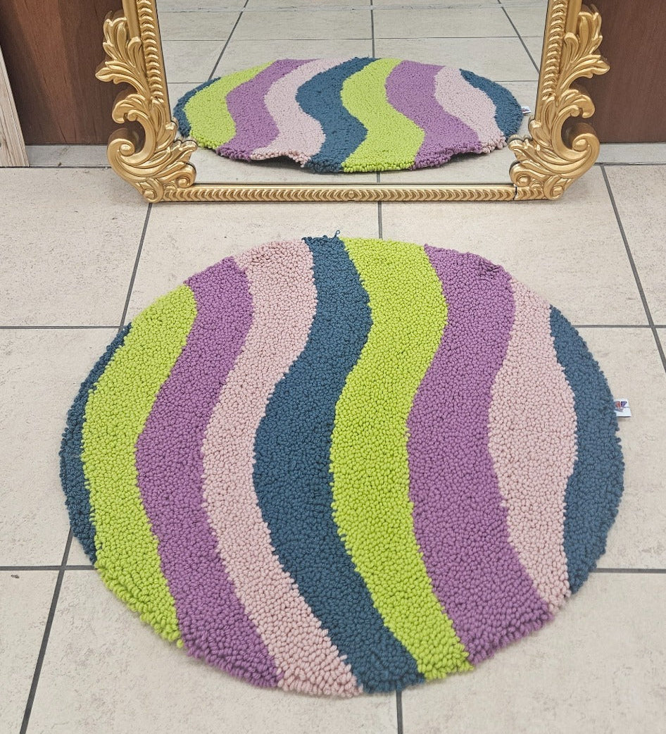 80s Yes colorful round loop-pile functional fiber art shown near mirror