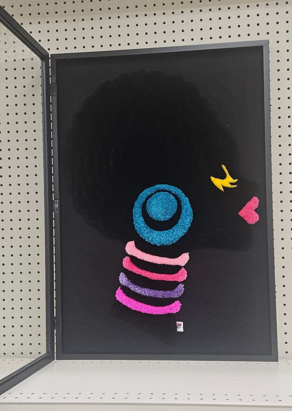 Crowned Silence black profile hand-tufted functional fiber art with colorful accents