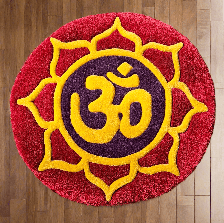 OM hand-tufted prayer and meditation fiber art with a yellow OM symbol on a red background
