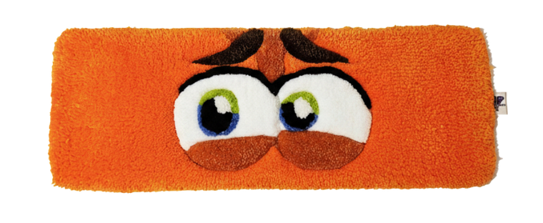 Anxiety Eyes hand-tufted fiber desk art with expressive orange eyes