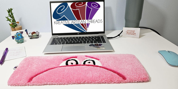 Embarrassment Eyes hand-tufted fiber desk art with soft pink sculpted eyes
