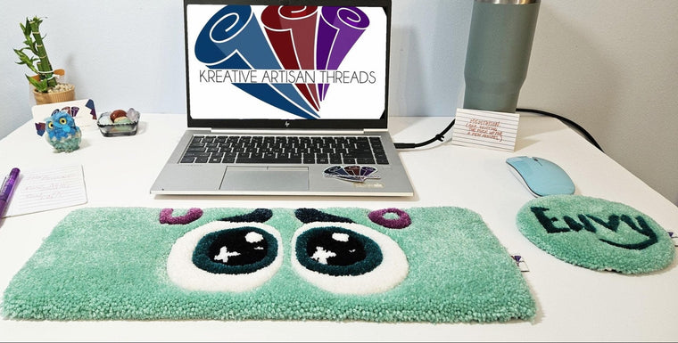 Envy Eyes hand-tufted fiber desk art duo with teal-green eyes and coordinating piece