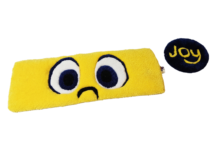 Joy Eyes hand-tufted fiber desk art duo with bright golden-yellow eyes