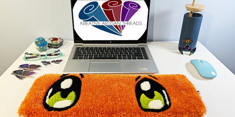 Charmander Eyes hand-tufted character-inspired fiber desk art in orange, cream, and blue