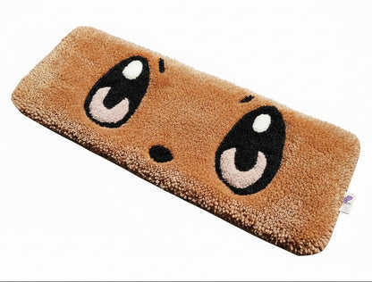 Keyboard on a cartoonish brown mat with facial features on a textured surface