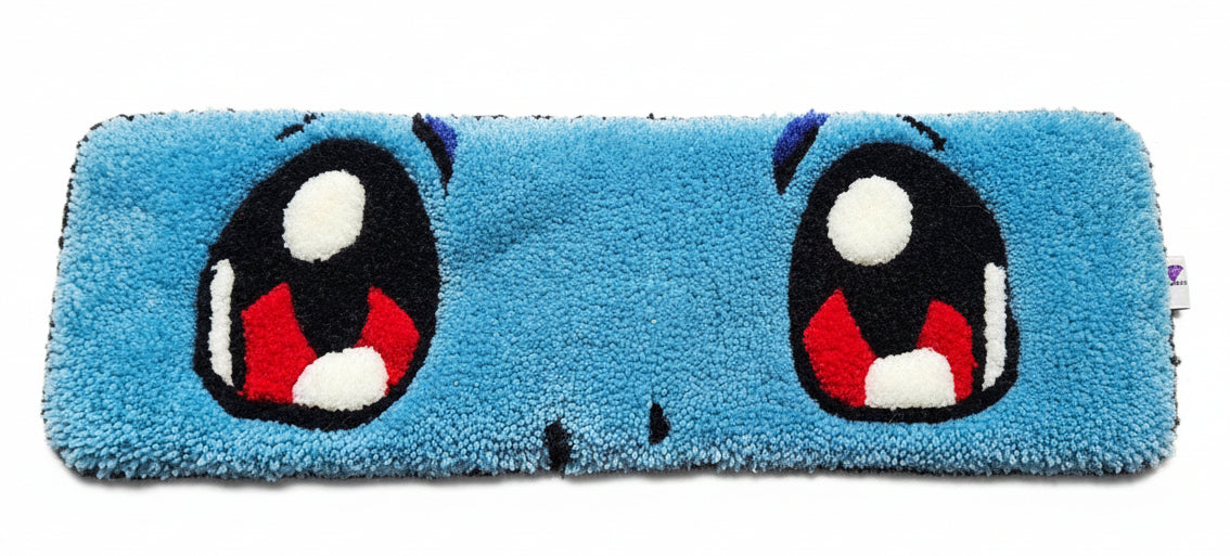 Blue keyboard mat with cartoon face design