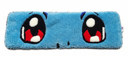 Blue keyboard mat with cartoon face design