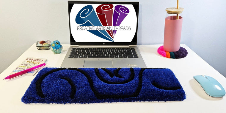 Blue Swirl hand-tufted fiber desk art with blue and black abstract swirl design