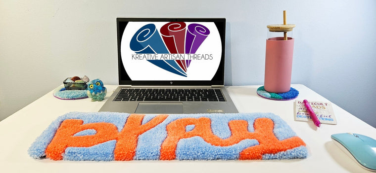PLAY hand-tufted fiber desk art with bold sculpted lettering