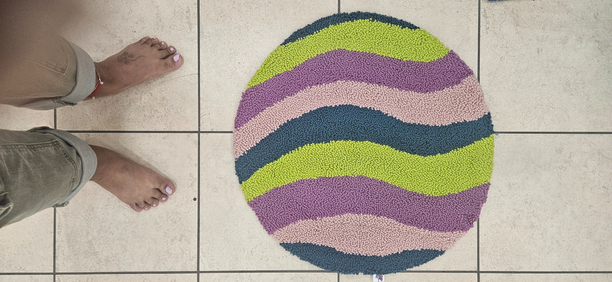 Purple Lime round loop-pile fiber art with wavy purple, lime, blush pink, and blue stripes