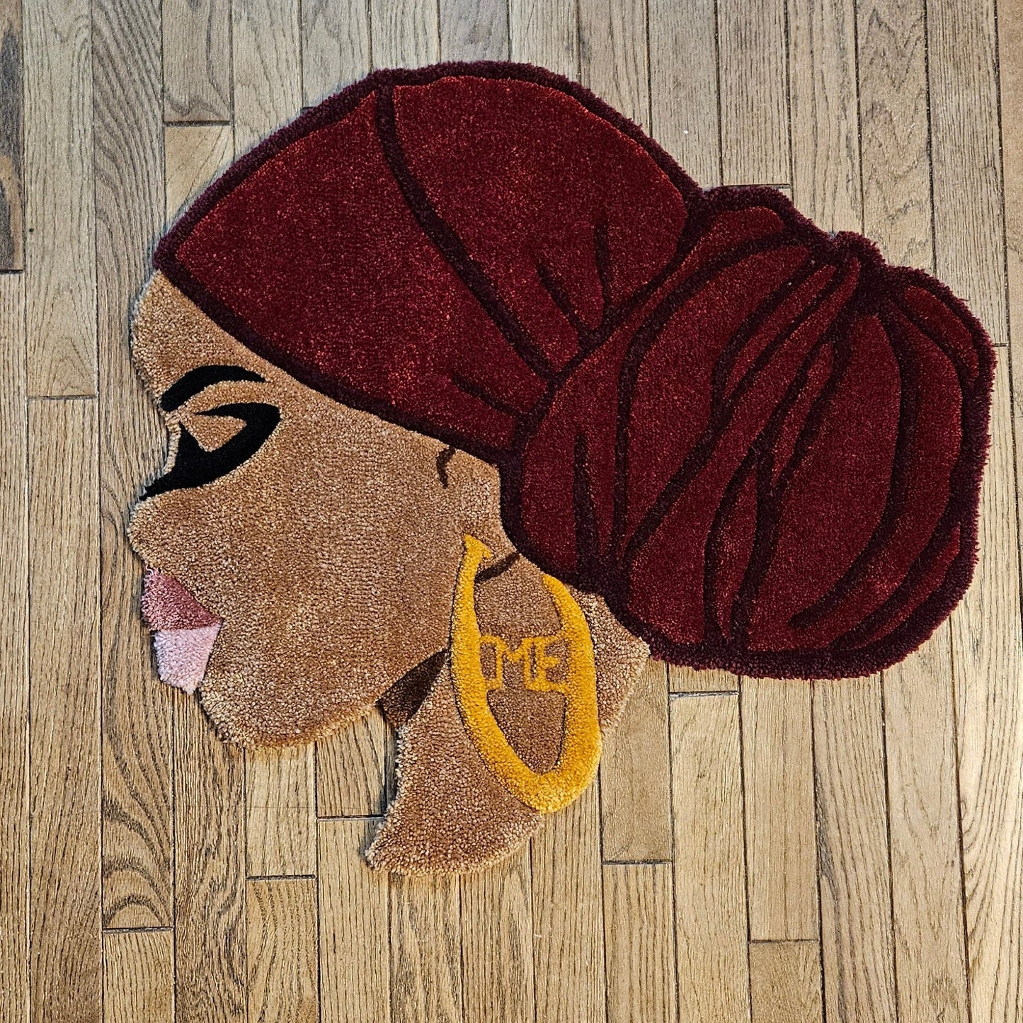 Ruby: Afrocentric Hand - Tufted Rug with Burgundy Headwrap and Gold Earring - Kreative Artisan Threads