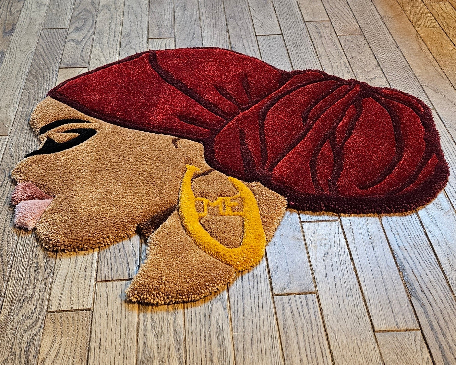 Ruby: Afrocentric Hand - Tufted Rug with Burgundy Headwrap and Gold Earring - Kreative Artisan Threads