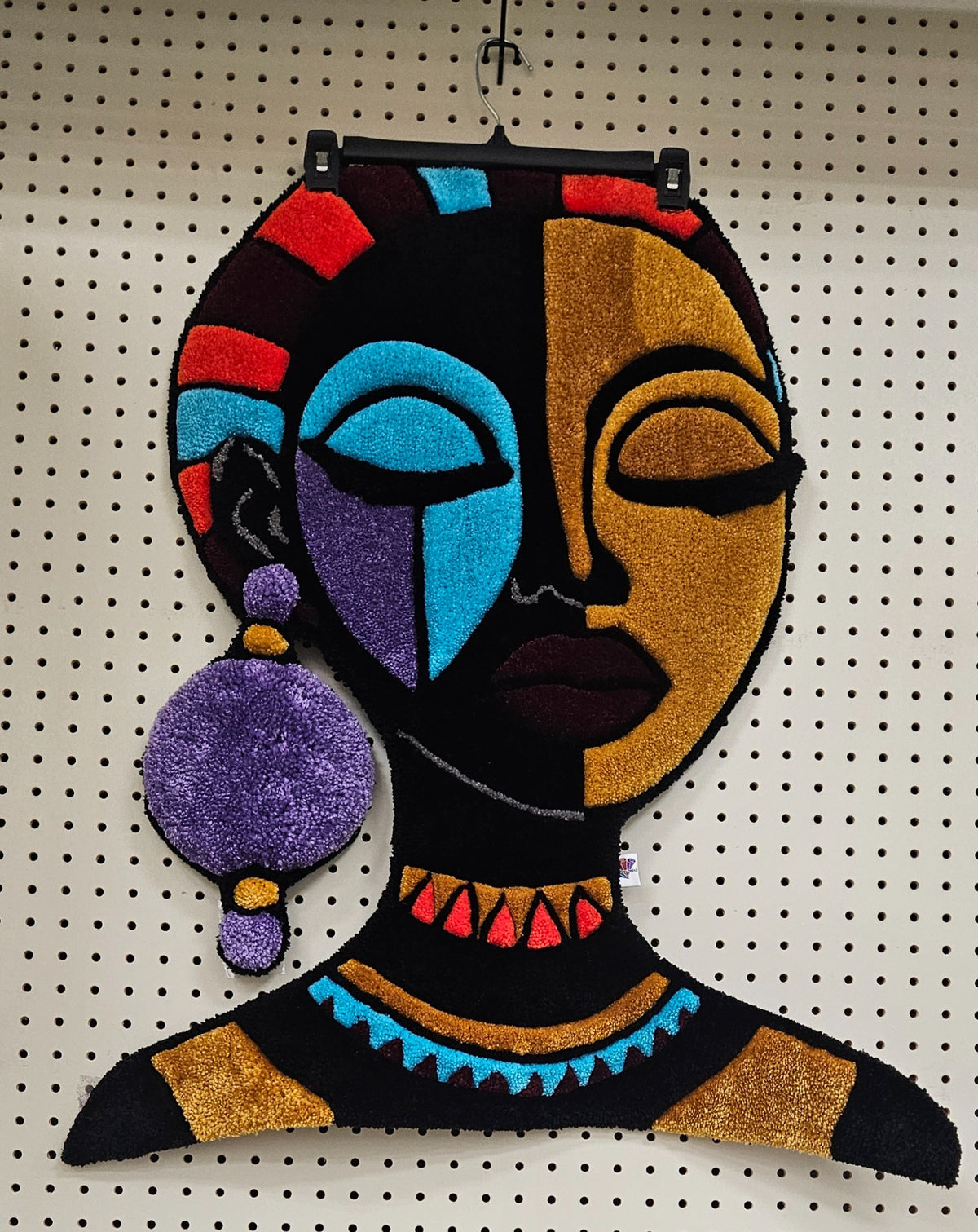 The Goddess Afrocentric hand-tufted functional fiber art portrait with purple earring